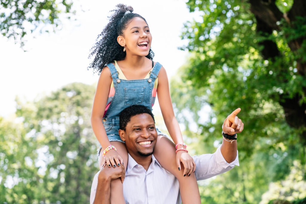 Father and daughter having fun together outdoors.